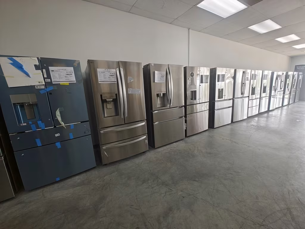 Black stainless and stainless refrigerators in a row